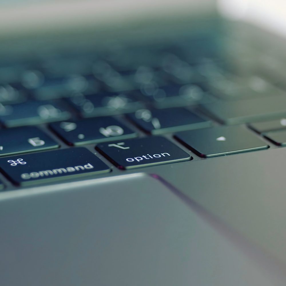 Silver laptop with black keybord details. Action. Close up of a new modern laptop, concept of